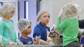 Traverse City School Packs 13,000 Meals for Those in Need