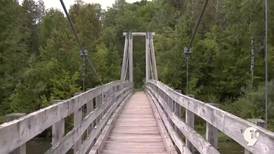 Sights and Sounds: Checking out the suspension bridge on the Manistee River