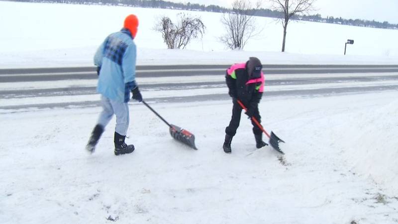 Promo Image: People In Cadillac Spend Hours Removing Snow