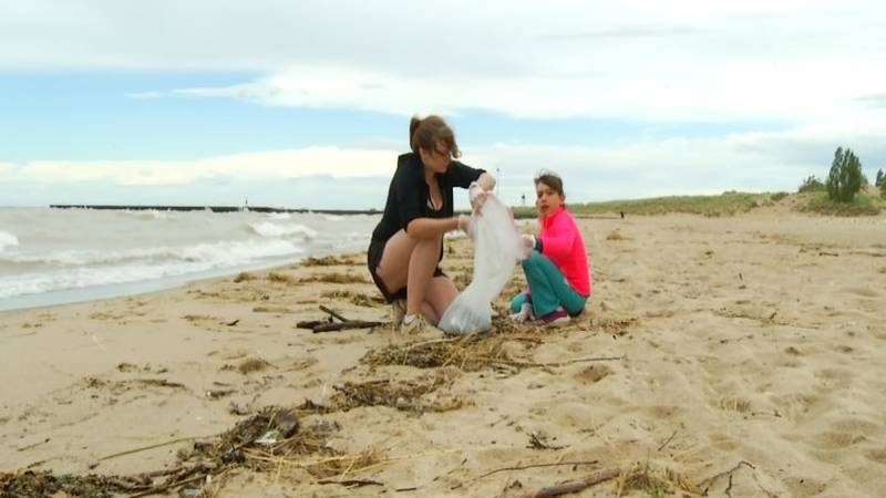 Promo Image: Manistee Family Gets Community Help Cleaning Dirty Beaches
