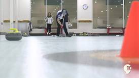 Learning how to curl with the Traverse City Curling Club at the National Cherry Festival